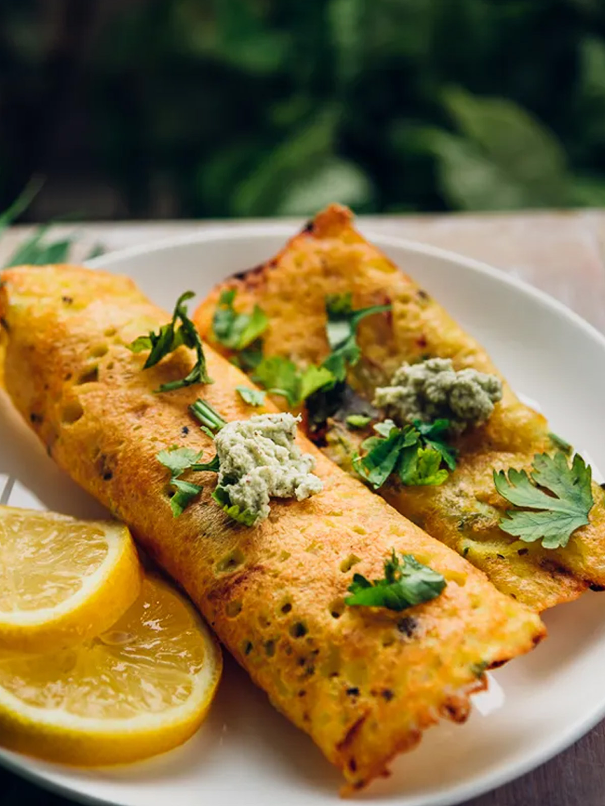 a dish served with lemon wedges in a plate