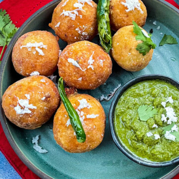 A Dish is served in a plate with chutney