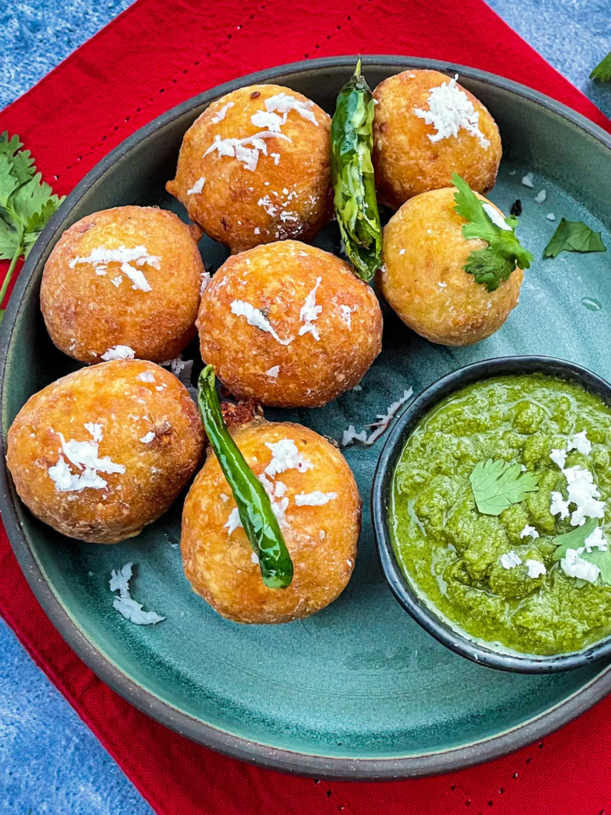 A Dish is served in a plate with chutney